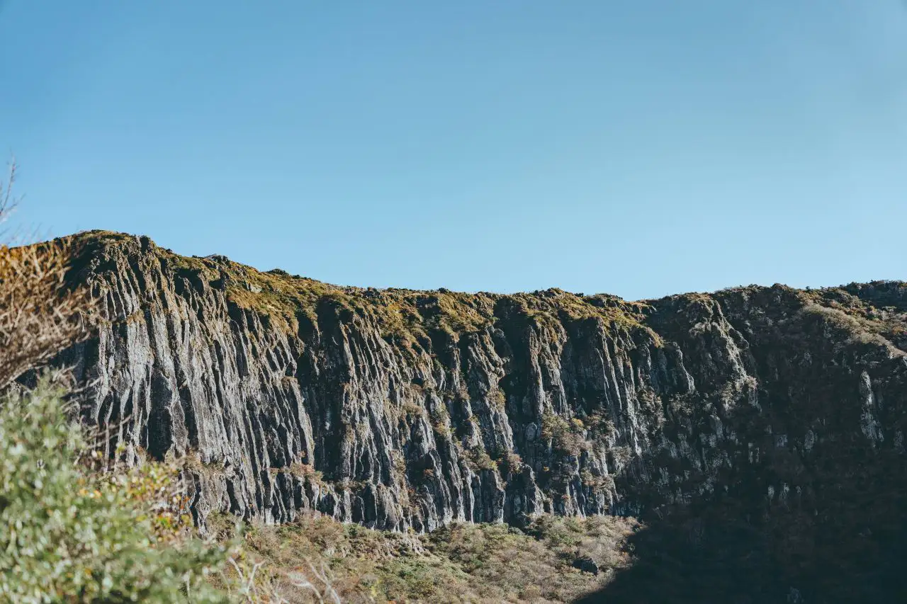 The columnar Byeongpung-bawi cliffs on the Yeongsil trail under a blue sky