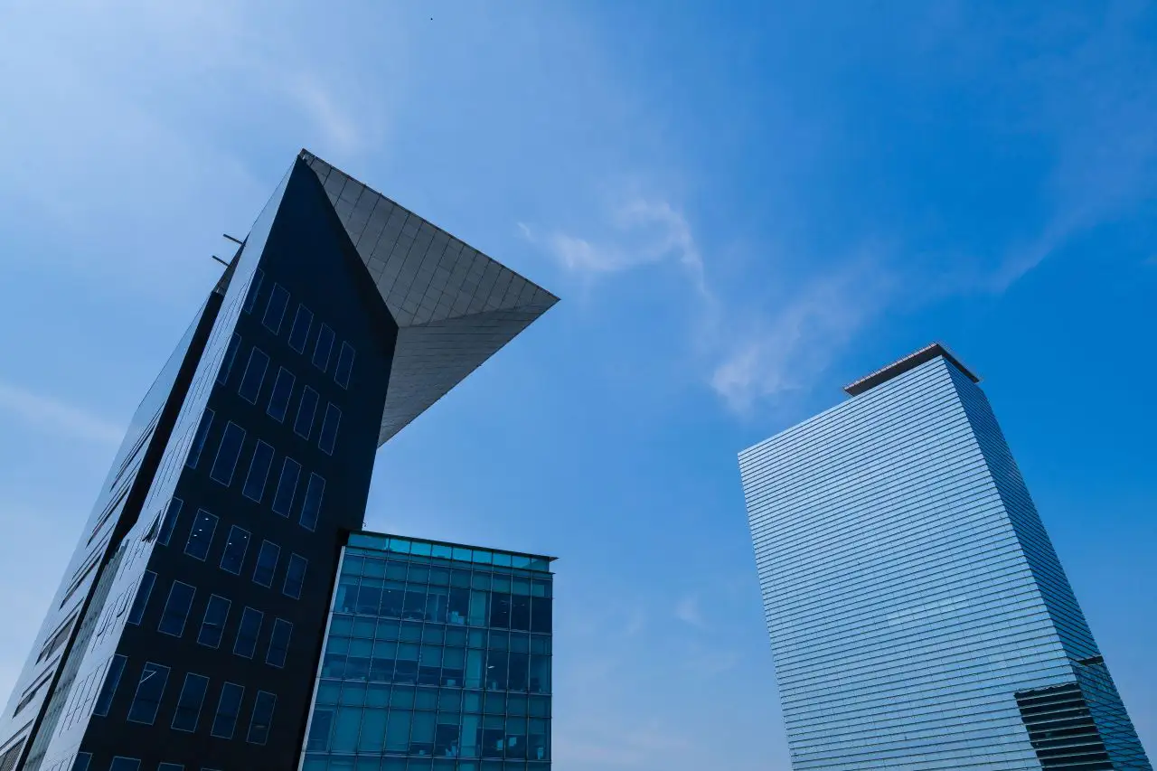 Glass towers angling up into a blue sky in central Gangnam