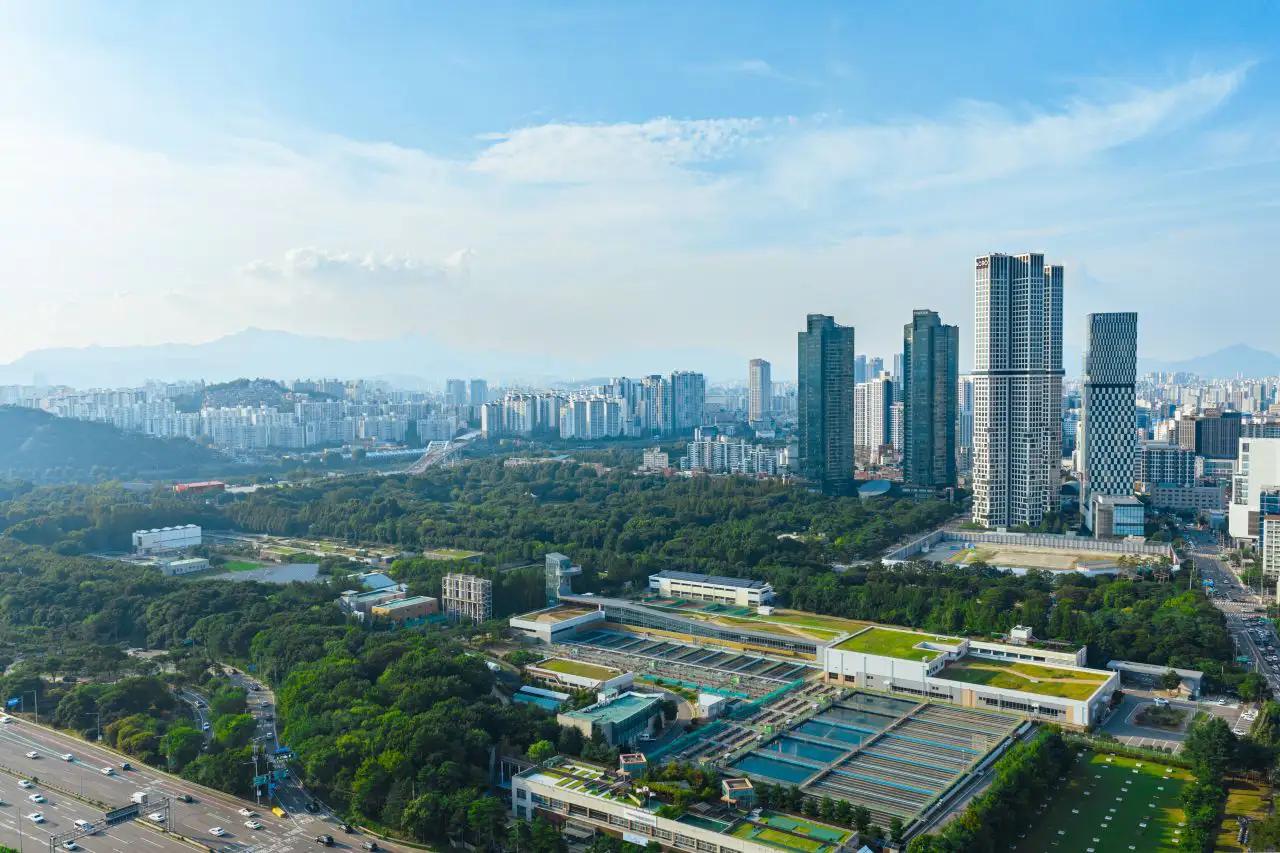 Aerial view of the Seoul Forest park with the Seongsu high-rises and mountains beyond